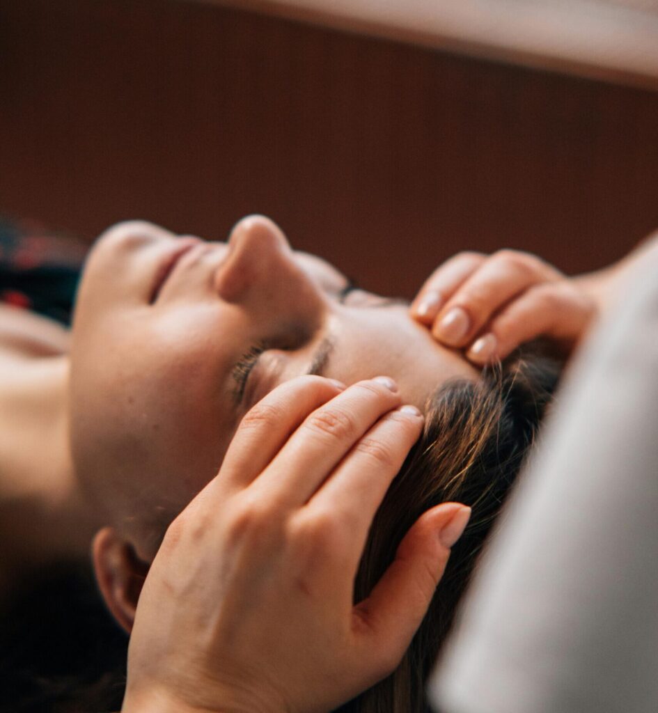 Close-up of a woman receiving a soothing massage at a spa for complete relaxation.